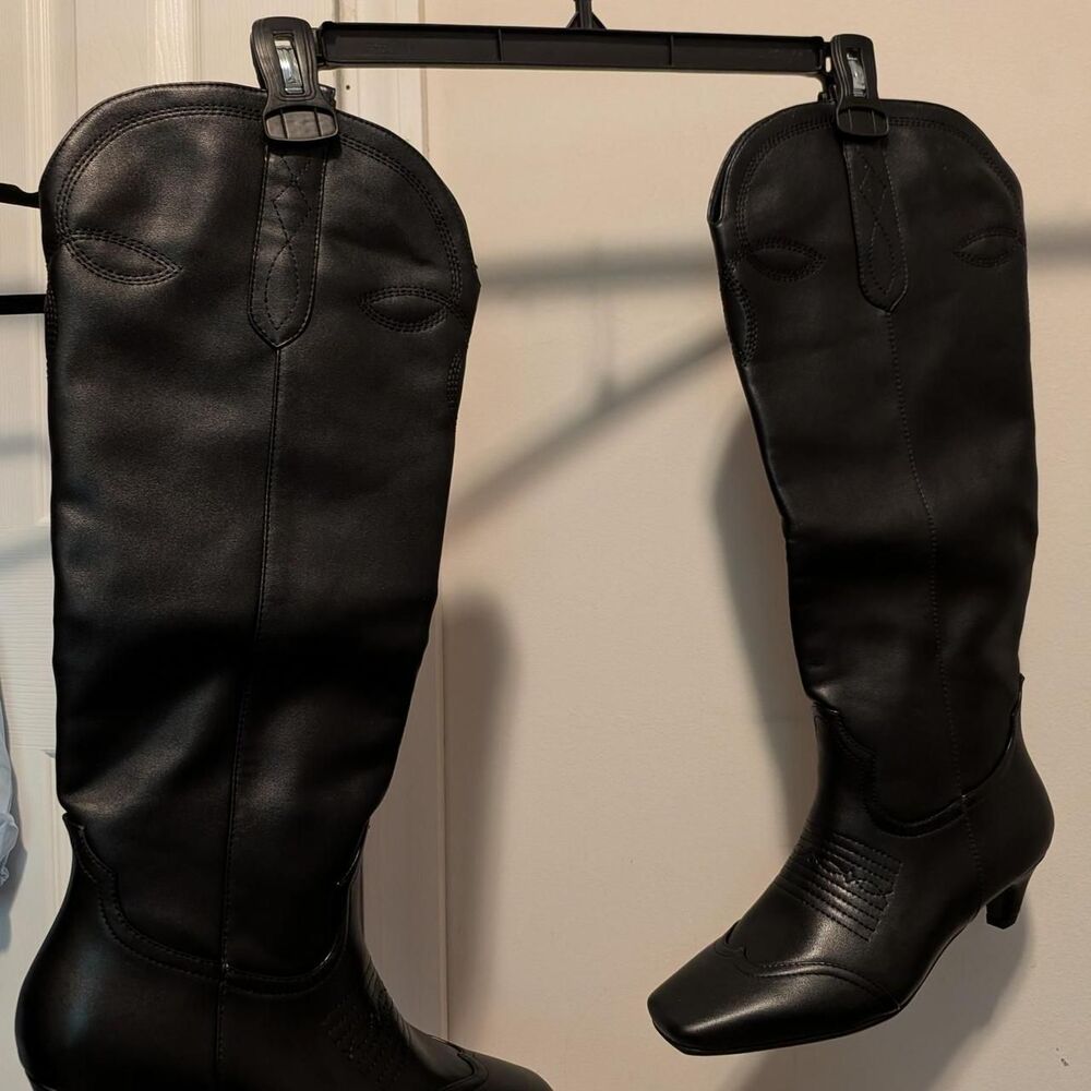 Black knee-high boots with pointed toe